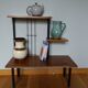 Shelf carries plants on feet modernist style