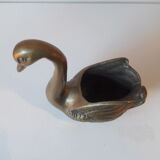 Empty brass swan pocket