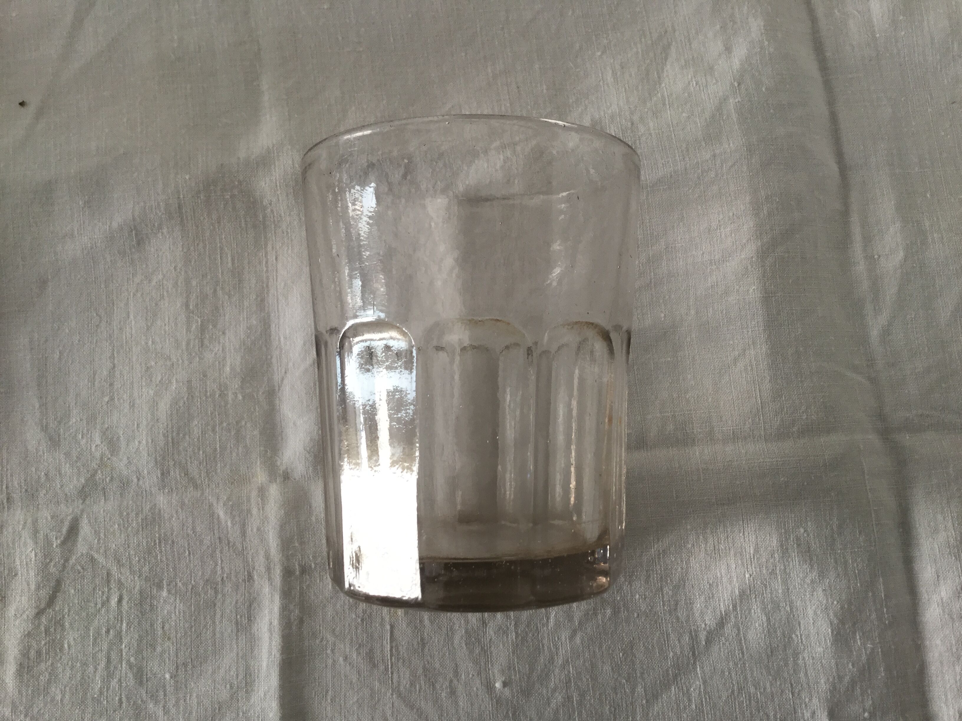Old ribbed glasses without a foot