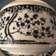 Large stoneware cup and saucer with delicate floral patterns