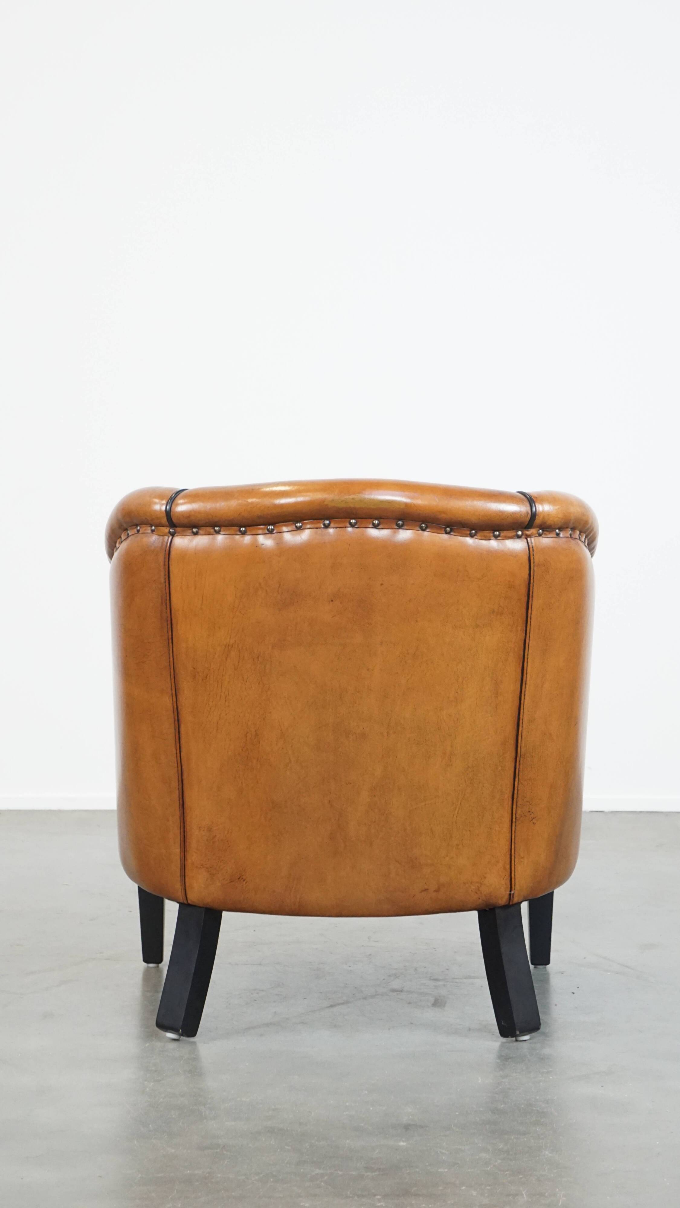 Sheep leather club chair finished with black piping