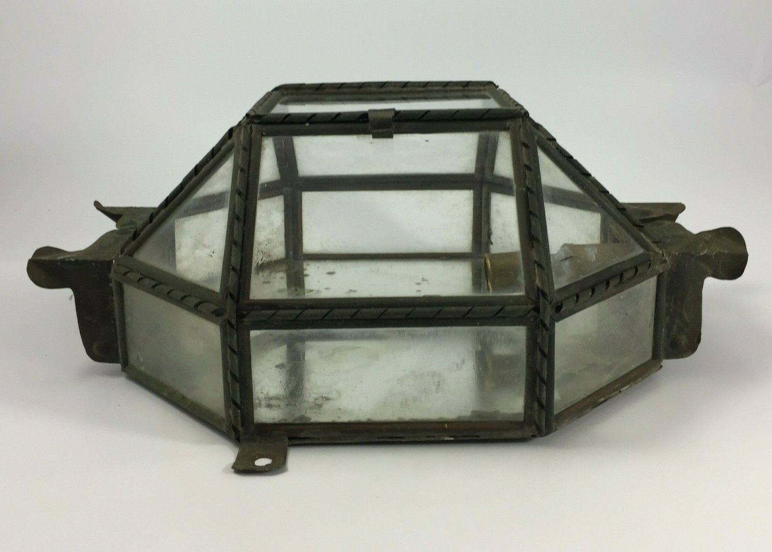 Metal and brass wall light with mirror background 1900