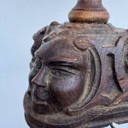 Sculpted wooden lamp with faces, antique.