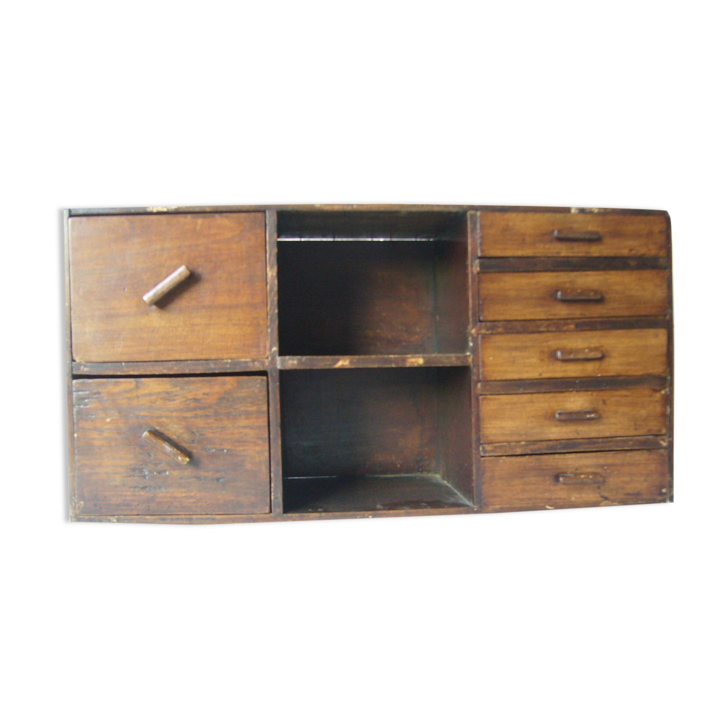 Antique, artisanal seven-drawer furniture