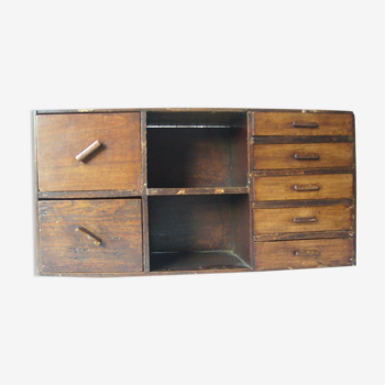 Antique, artisanal seven-drawer furniture