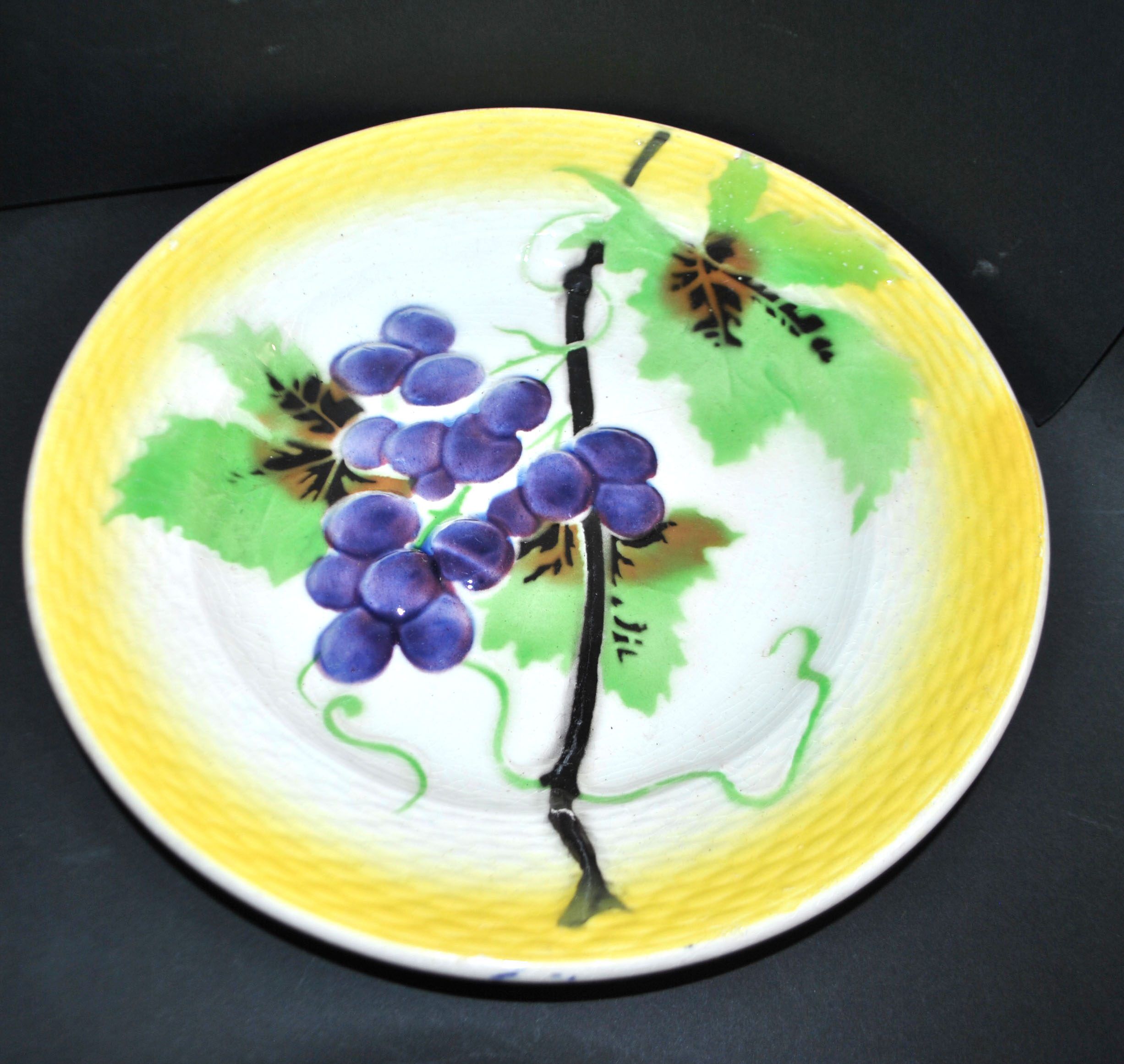 Orchies set of 6 yellow earthenware dessert plates with stencilled fruit decoration.
