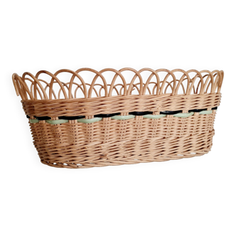Rattan basket with green and black strands