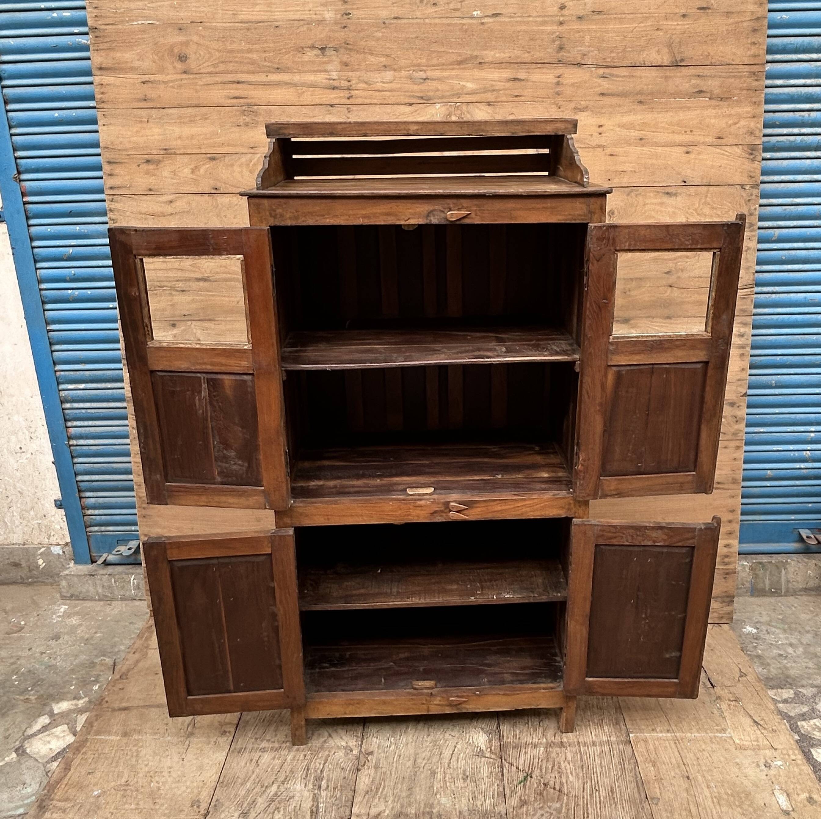 Art Deco glass-fronted cabinet in Burmese teak with original patina.