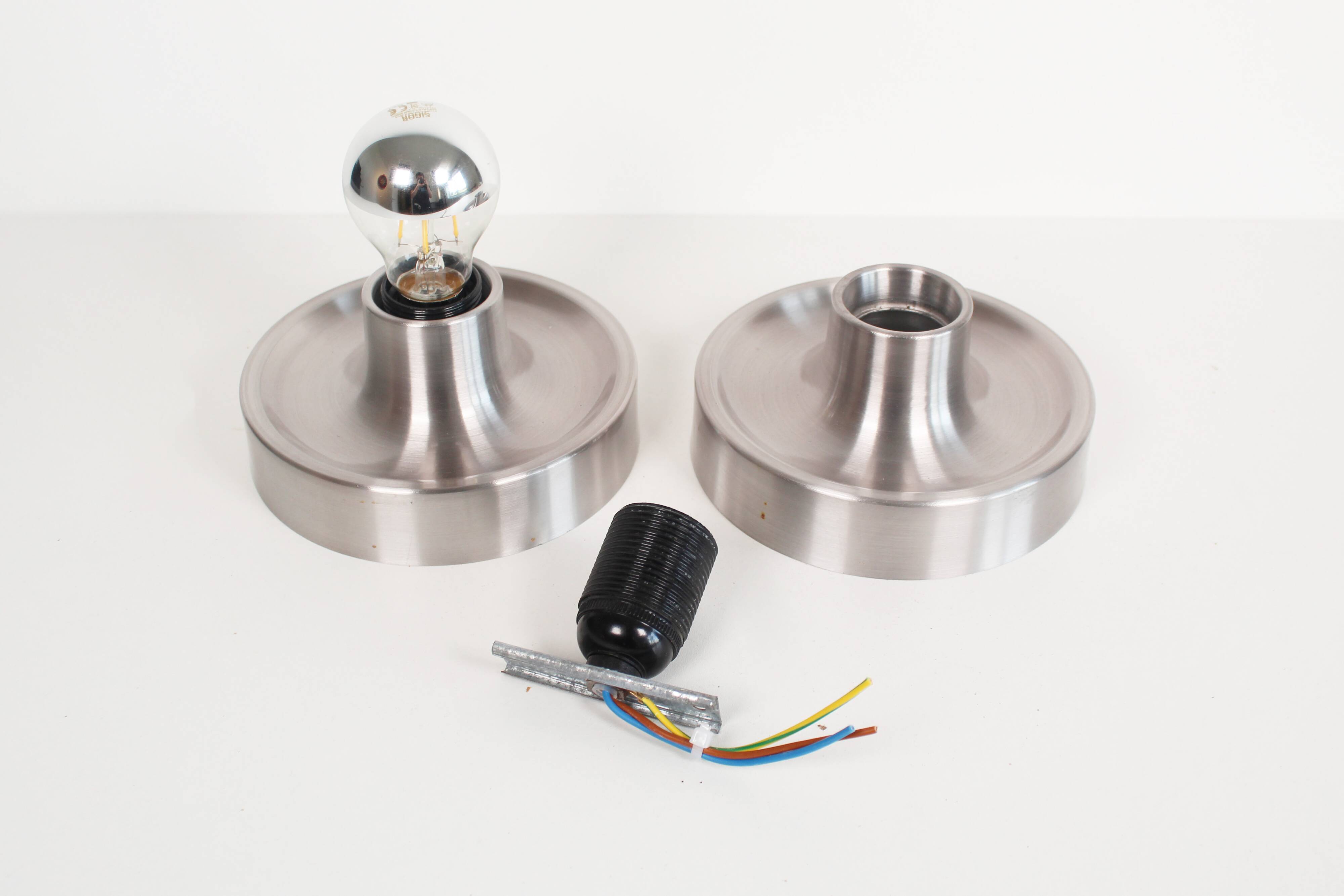 Pair of petite Disc sconces selected by Charlotte Perriand for Les Arcs