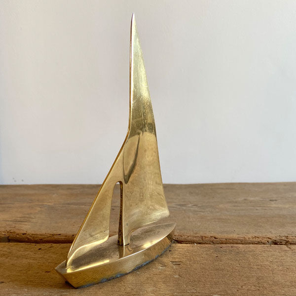 Golden brass sailboat