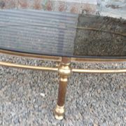 Oval coffee table in gilded brass and smoked glass 1970