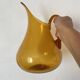 Blown glass jug with caramel bubbles
