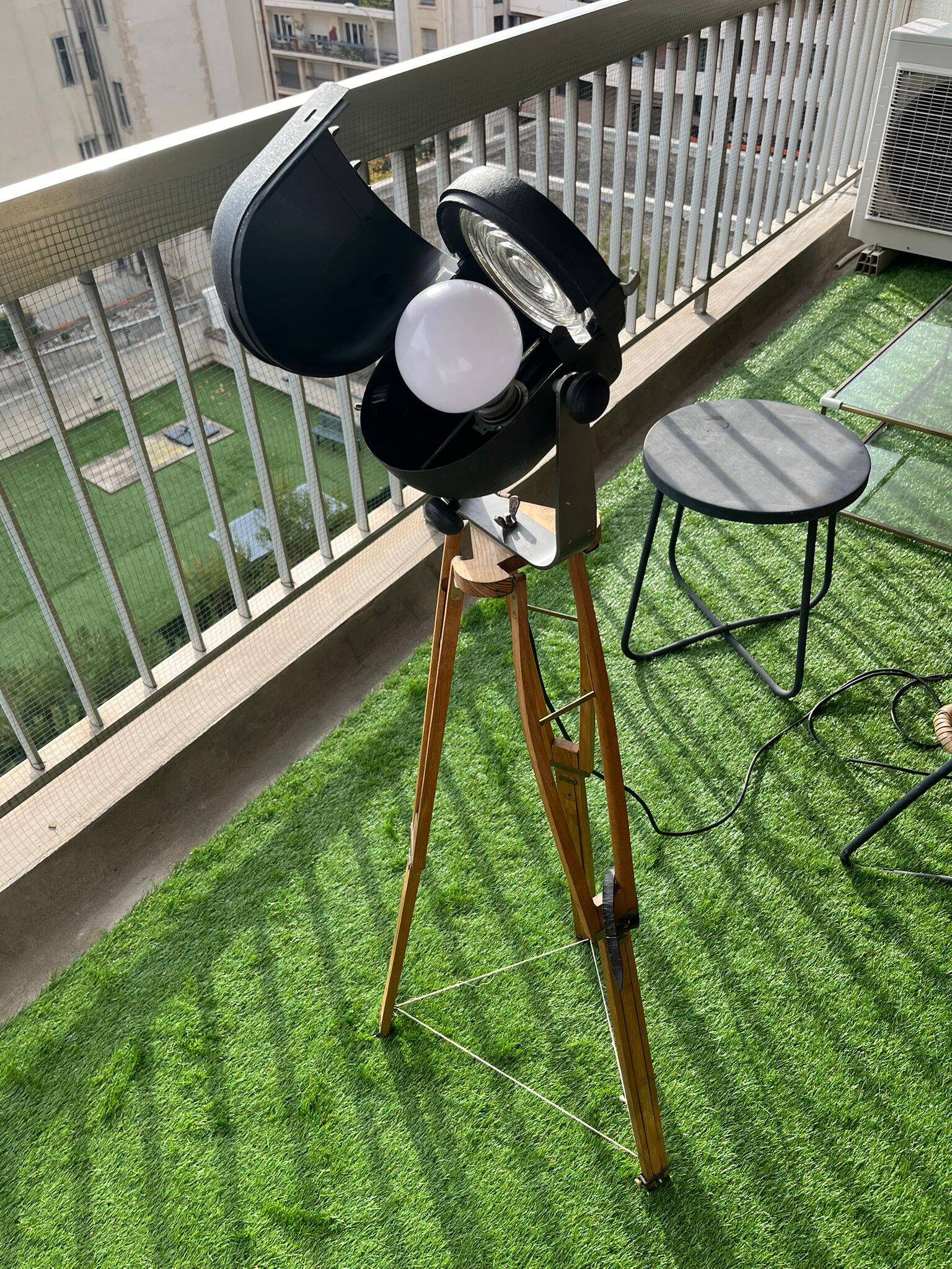 Floor lamp in the style of a cinema projector.