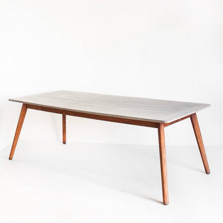 Scandinavian style dining table. Polished and varnished wood and concrete. For indoor or outdoor use.