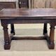 English monastery table with extensions from the late 19th century in elm and oak.