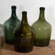 Antique green demijohns (circa 1920). Set of 3 pieces
