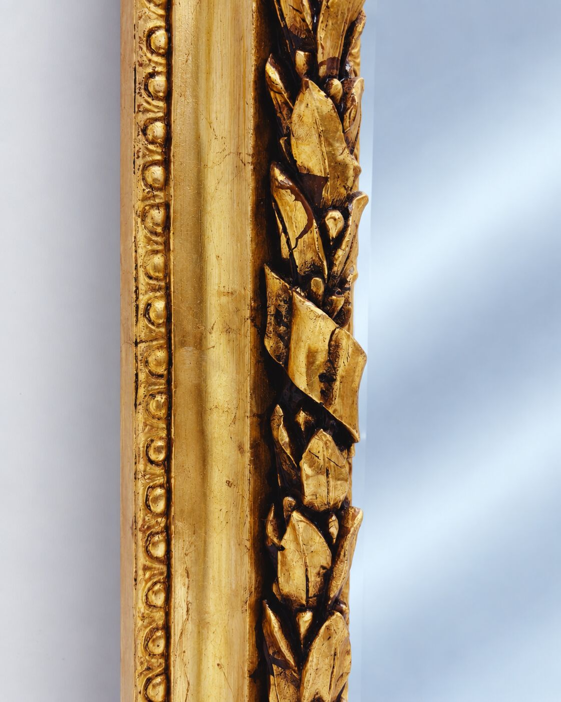 Large gold full-length mirror with ornate crest