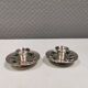 Silver-plated candle holders with inlaid red and green enamel
