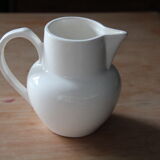 Old pitcher in white earthenware
