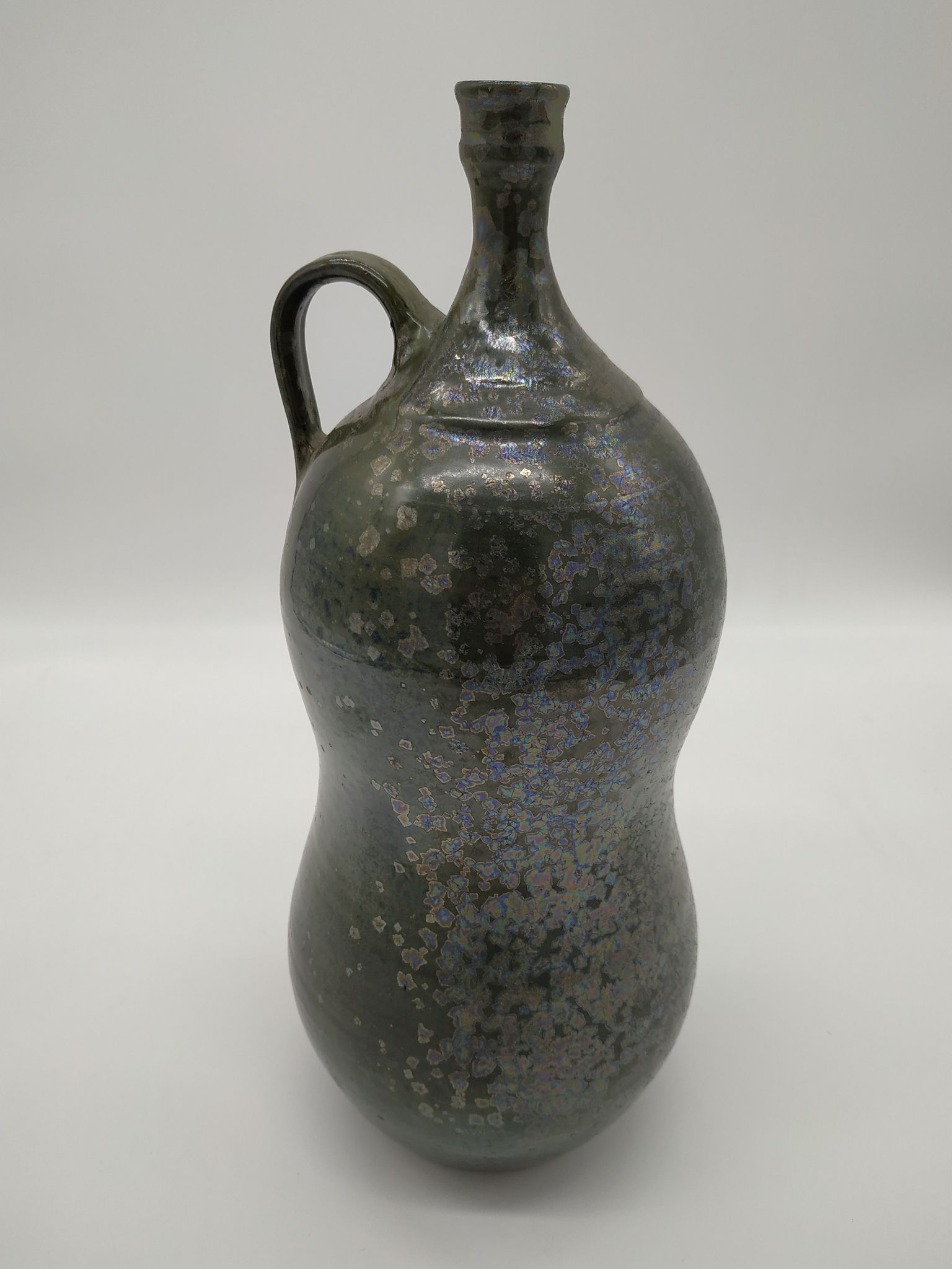 Bottle in iridescent green sandstone from the ceramist jean aimé Poirier