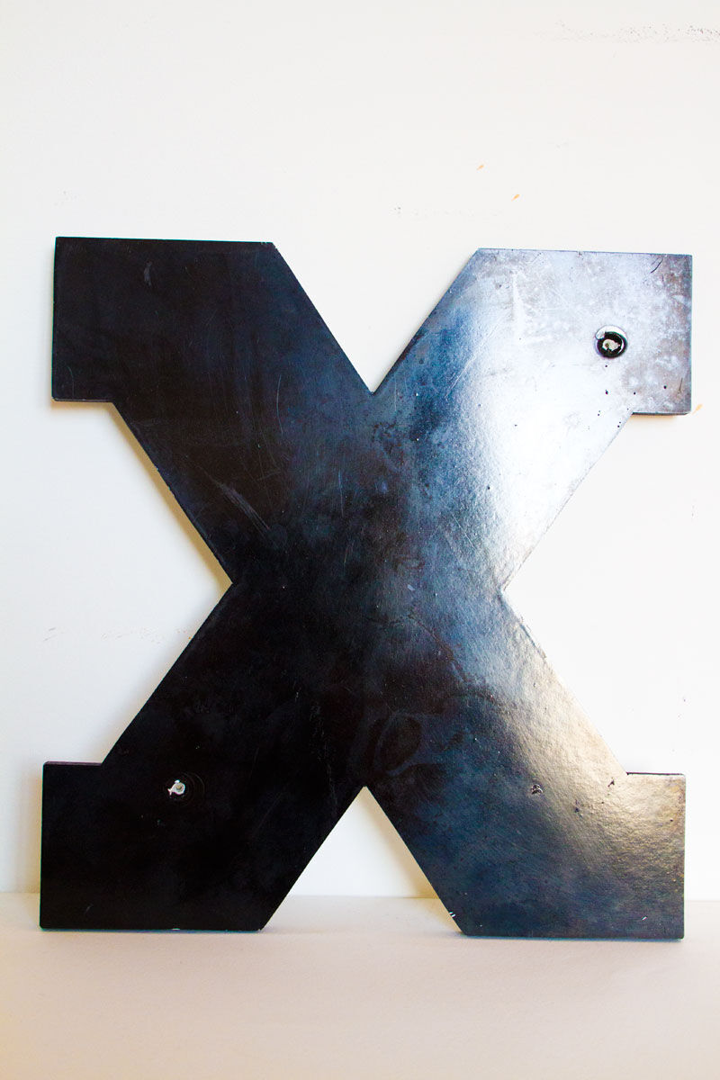 Enamelled letter X