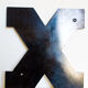 Enamelled letter X