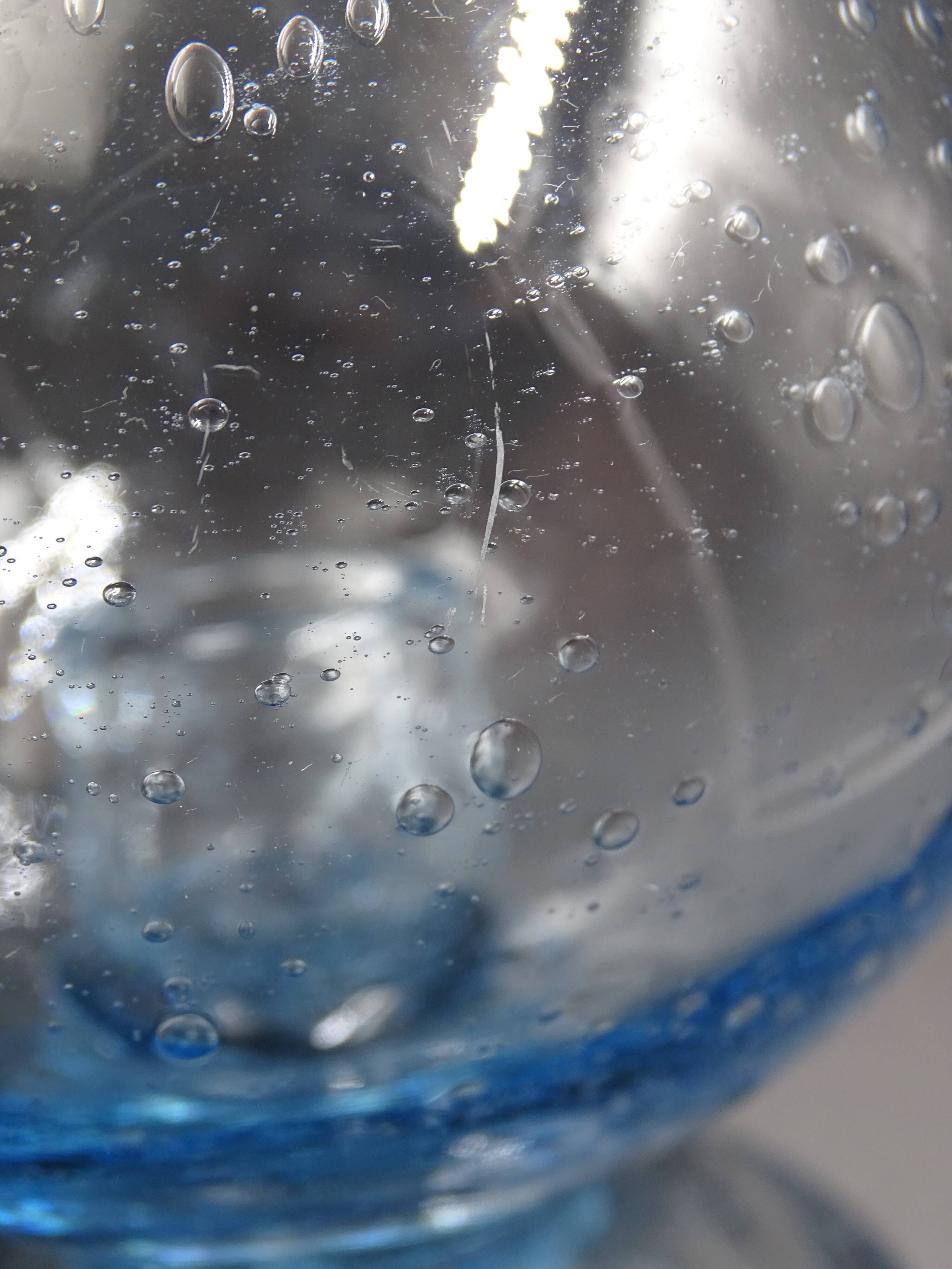 Candlestick or photophore in sky blue bulled glass, signed Biot