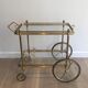 Neoclassical brass rolling table from Maison Baguès