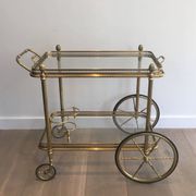 Neoclassical brass rolling table from Maison Baguès