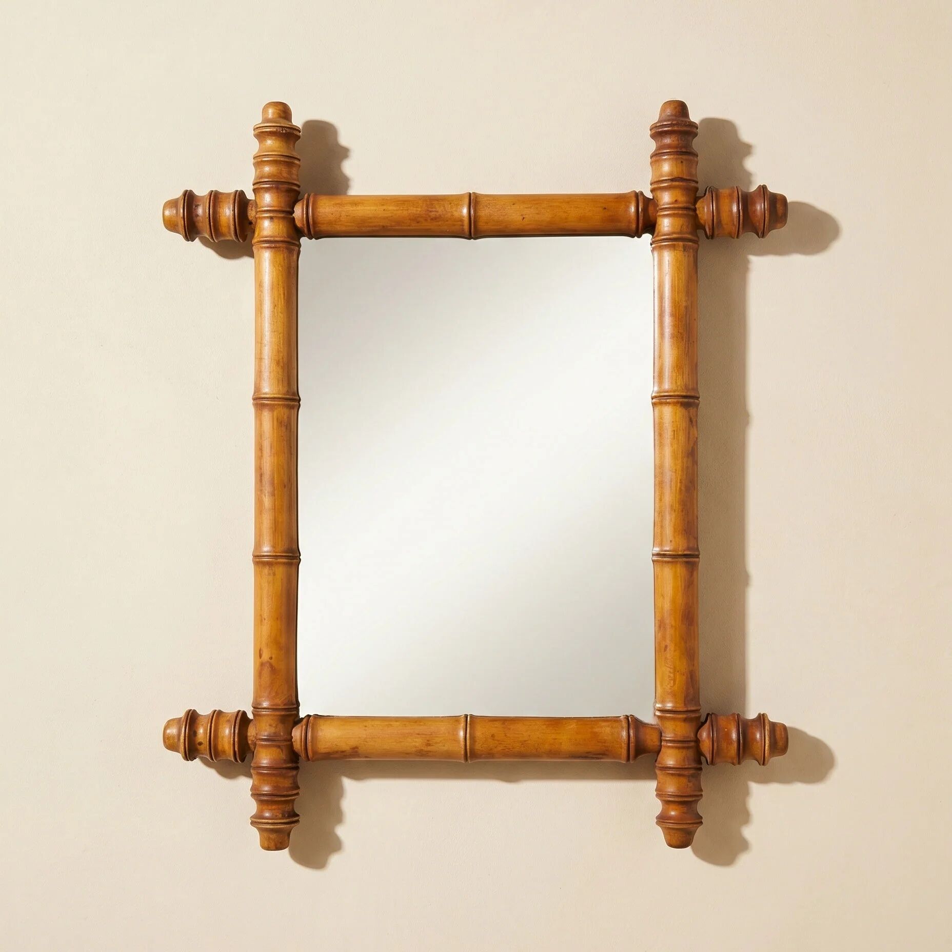 Wooden turned mirror in bamboo style, circa 1900-1930.