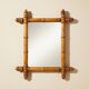 Wooden turned mirror in bamboo style, circa 1900-1930.