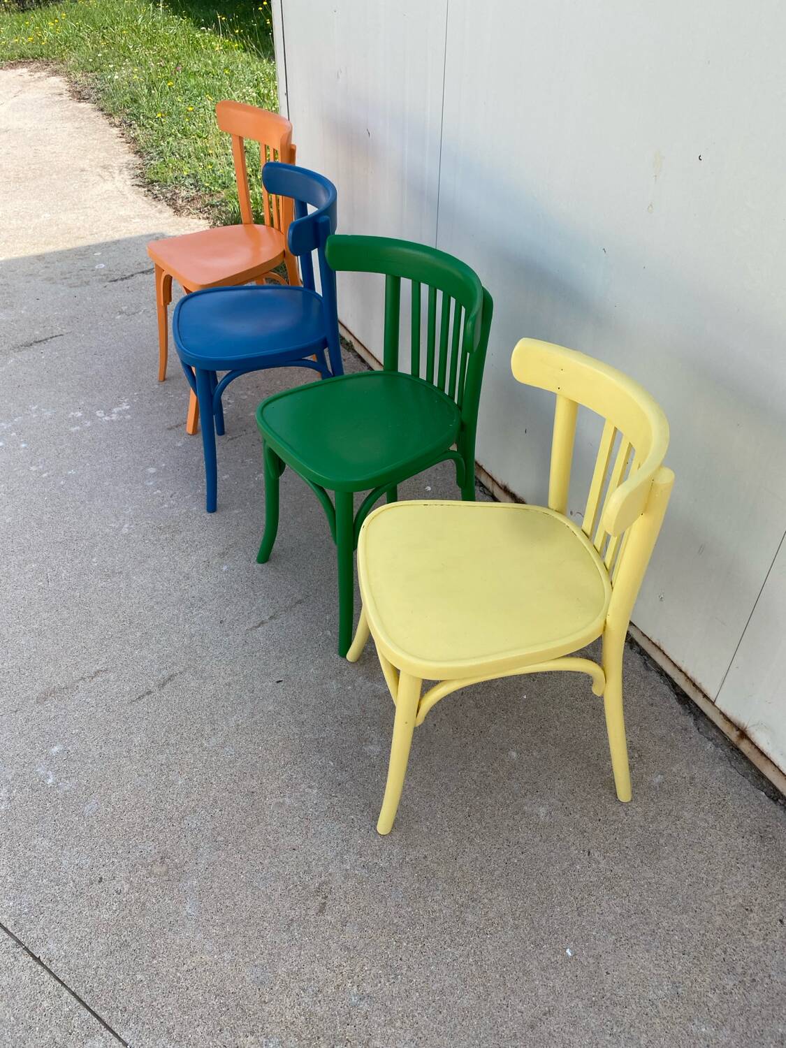 4 multi-colored bistro chairs