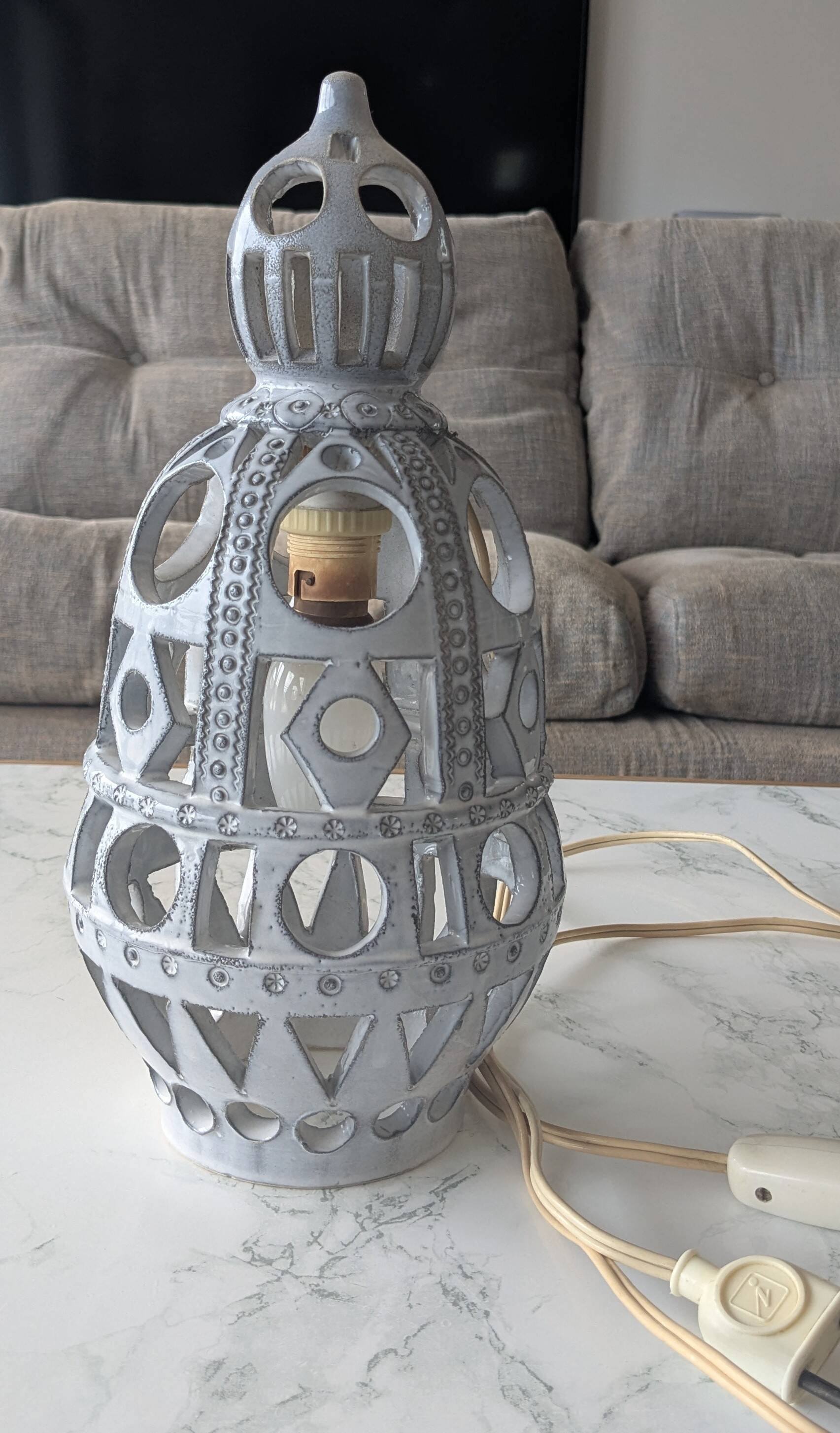 Ceramic lamp with cut-out design in the style of Roger Collet, 1960s.