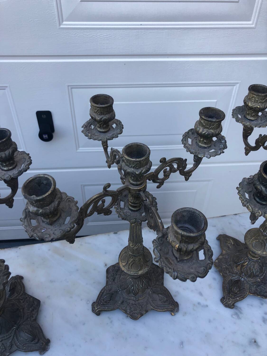 4 identical old brass candlesticks