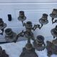 4 identical old brass candlesticks