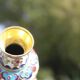 Two small vintage cloisonné enamel vases with Asian floral decoration.