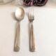 Set of 2 silver metal cutlery with punches