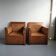 Pair of wooden and caned armchairs
