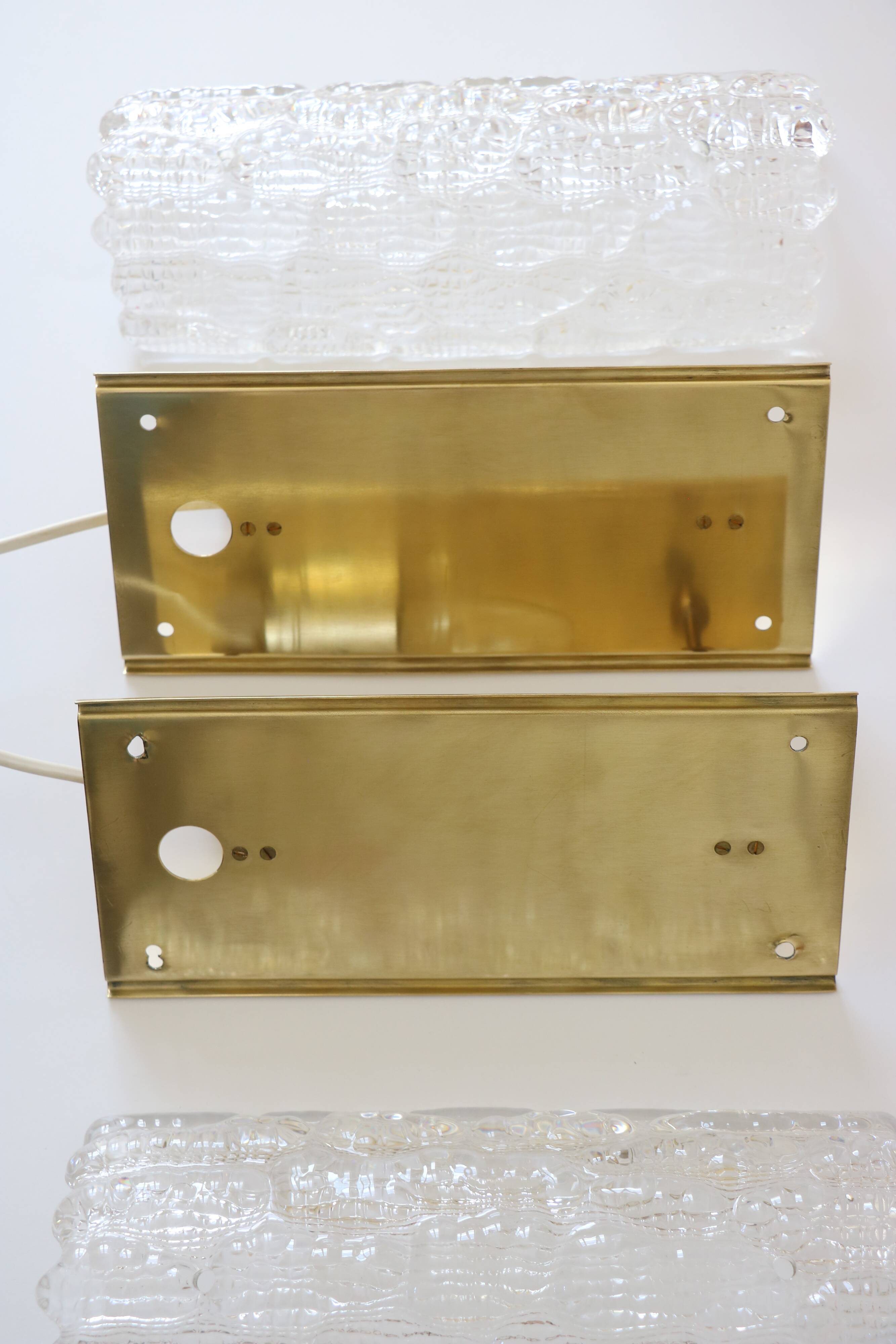 Pair of glass and brass wall lights by Carl Fagerlund for Orrefors.