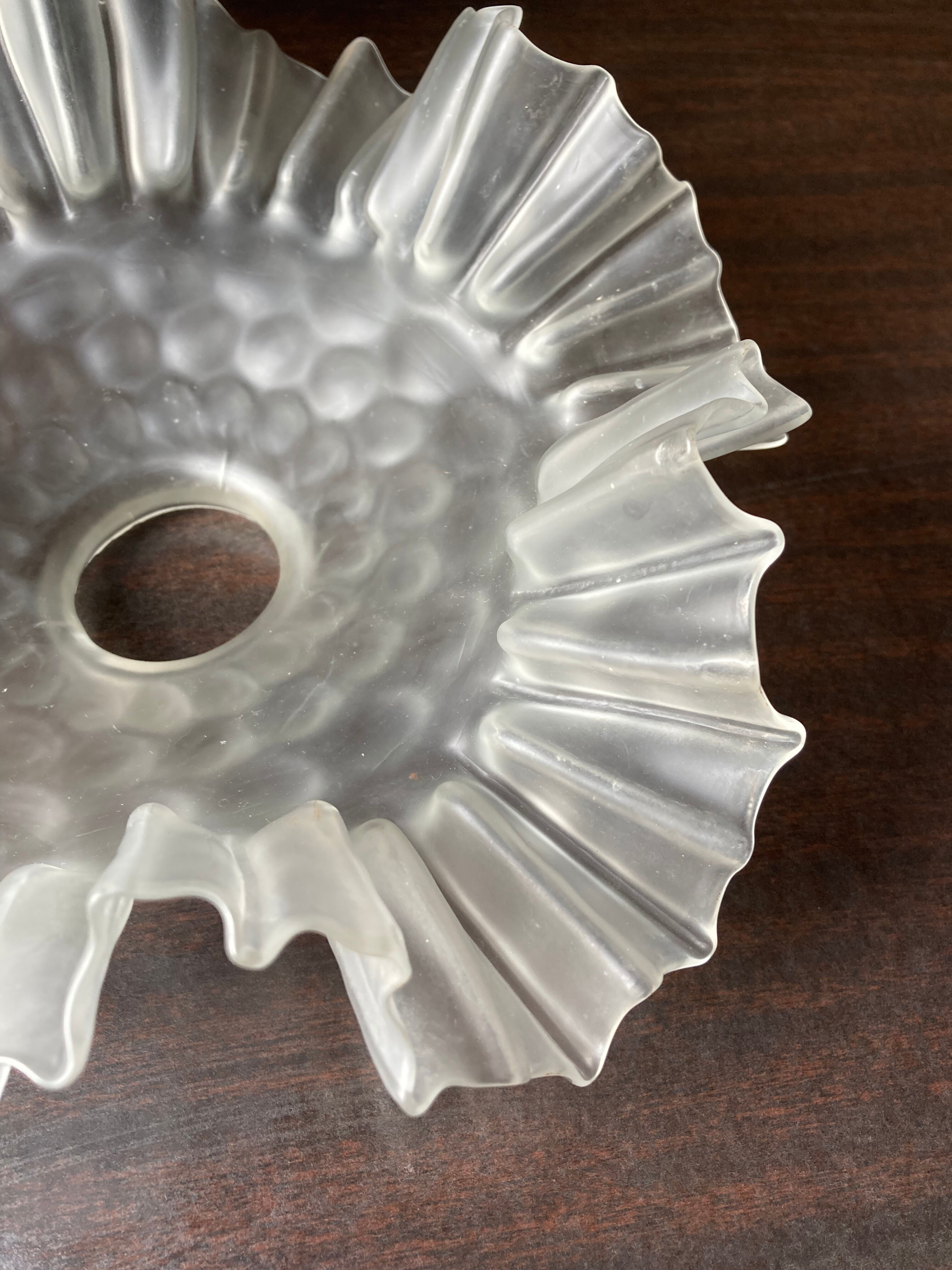 Transparent molded glass suspension in flower shape