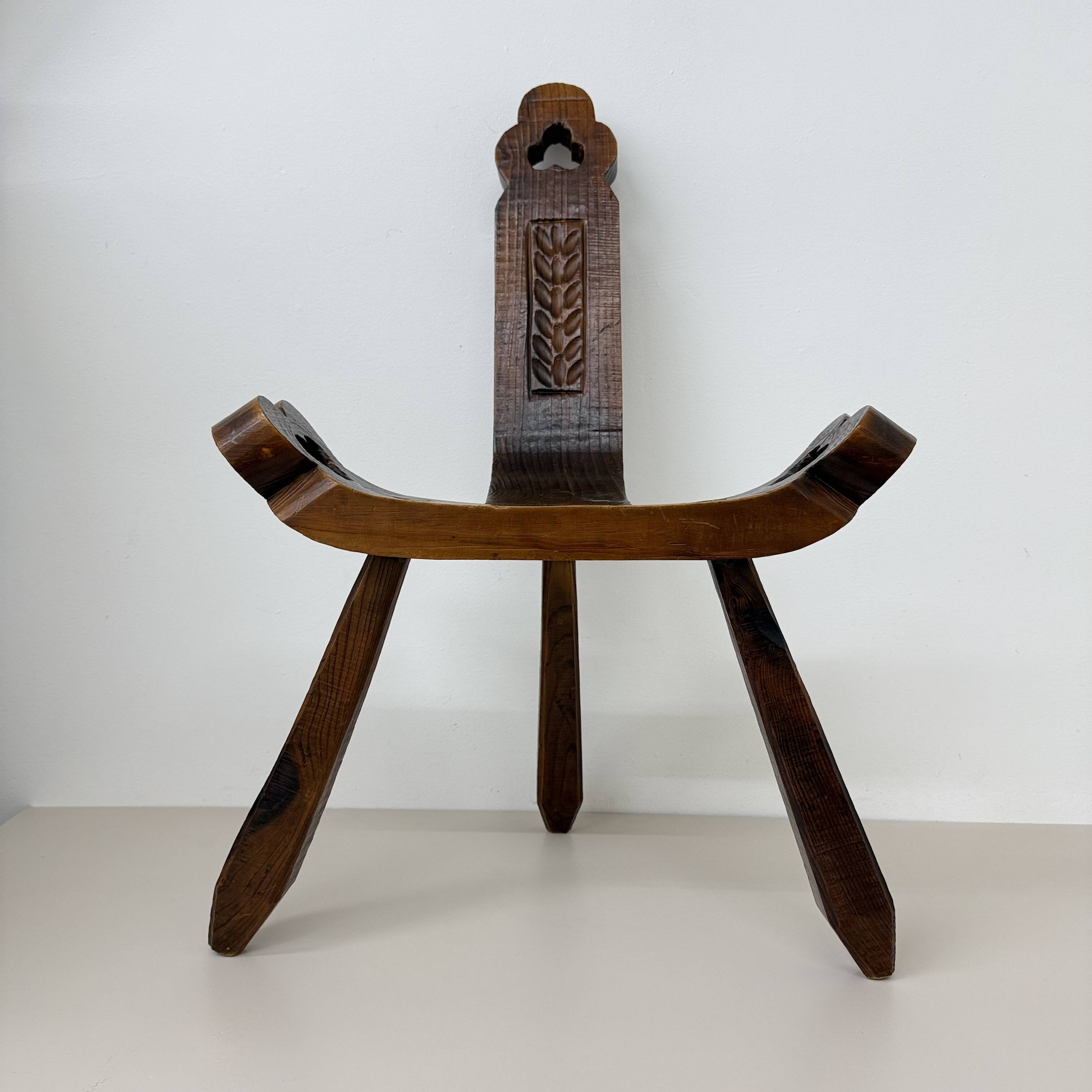 Brutalist hand carved oak Spanish tripod chair , 1970s