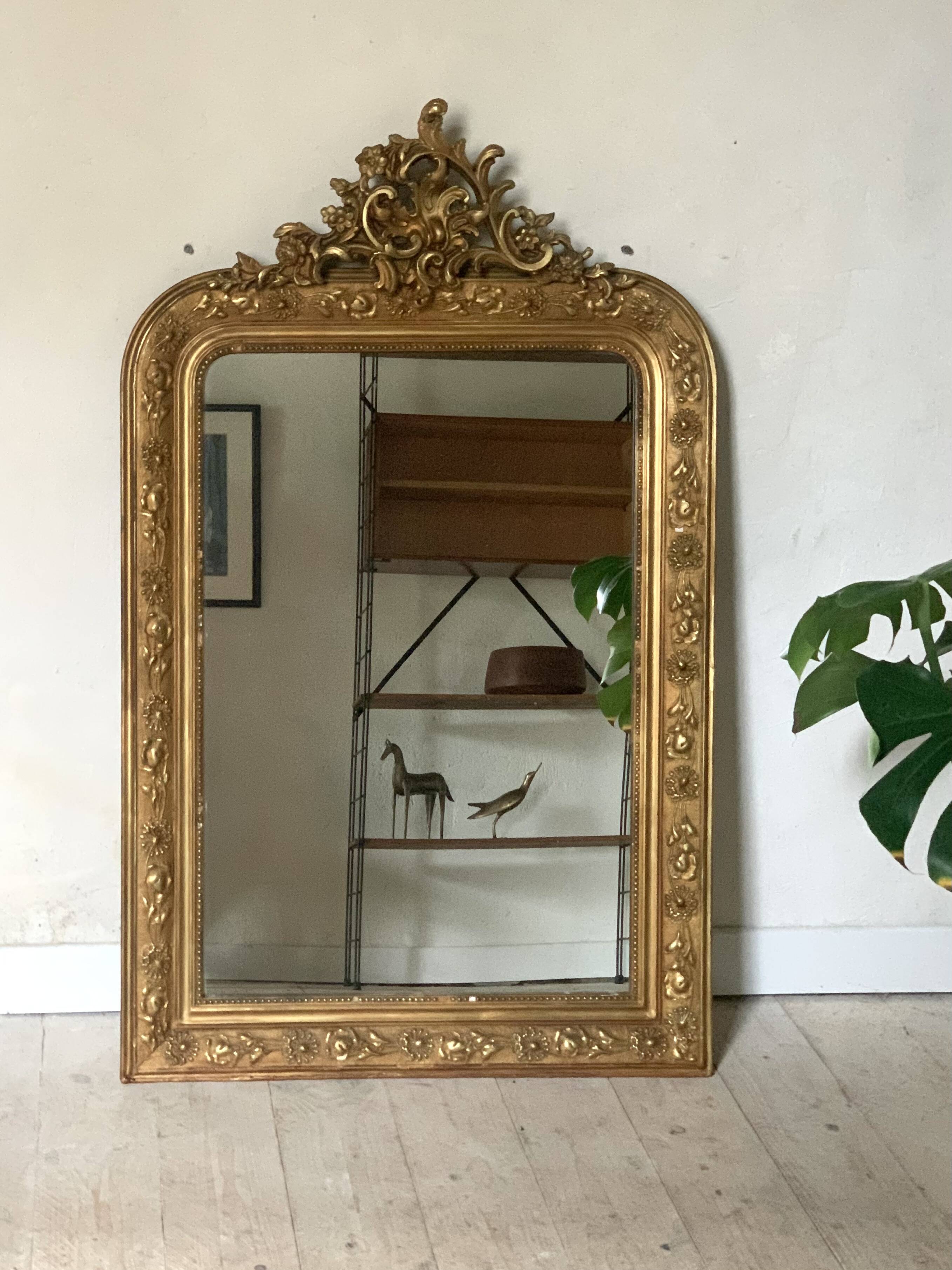 Golden fireplace mirror with pediment