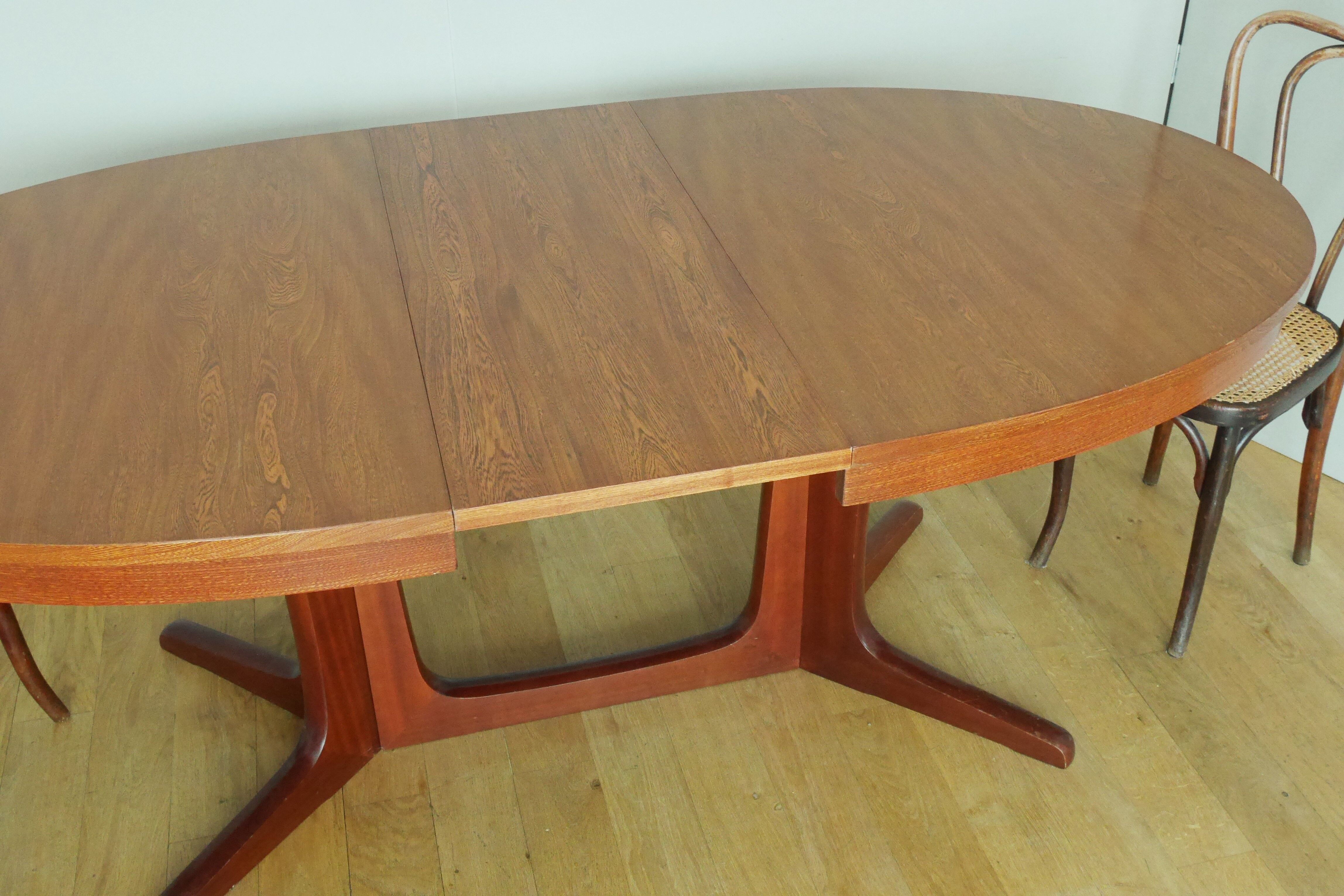 Scandinavian style oval table in central foot with extensions