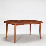 Dining table with a solid teak extension
