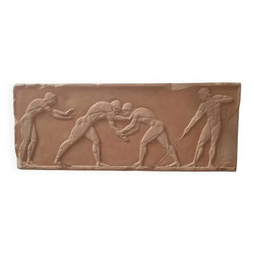 Bas-relief in the antique style featuring athletes.