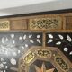 Blackened wood display table with marquetry top, Spain, 19th century.
