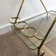 Italian designer rolling table in brass and engraved glass
