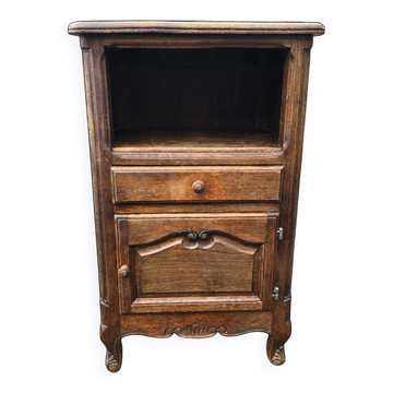 Small accent piece in carved oak in Louis XV style.