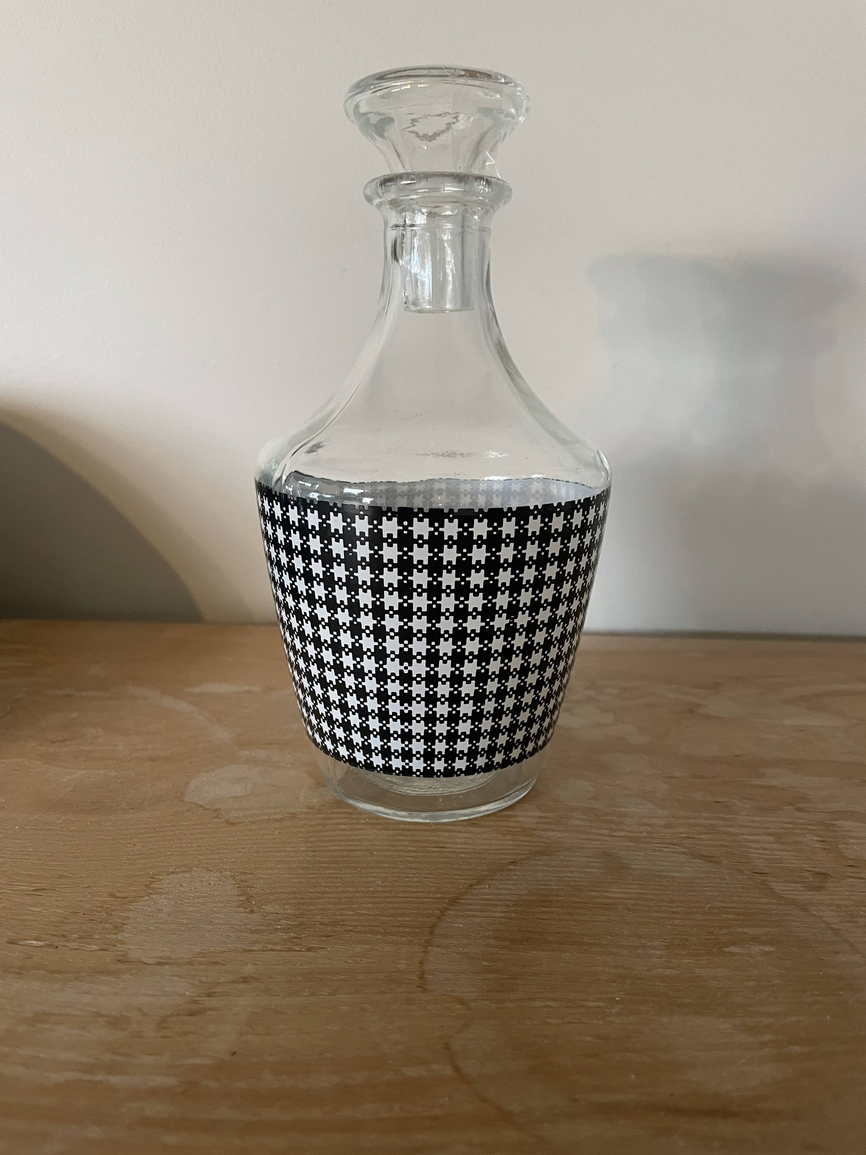 Small black and white checkered carafe with original glass stopper