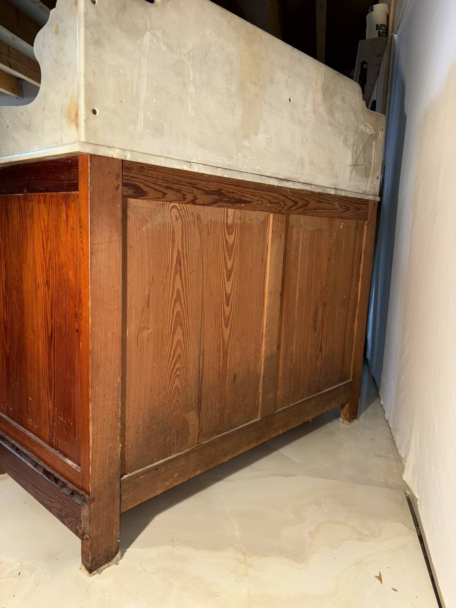 Antique wood and marble kitchen sideboard with carved backsplash